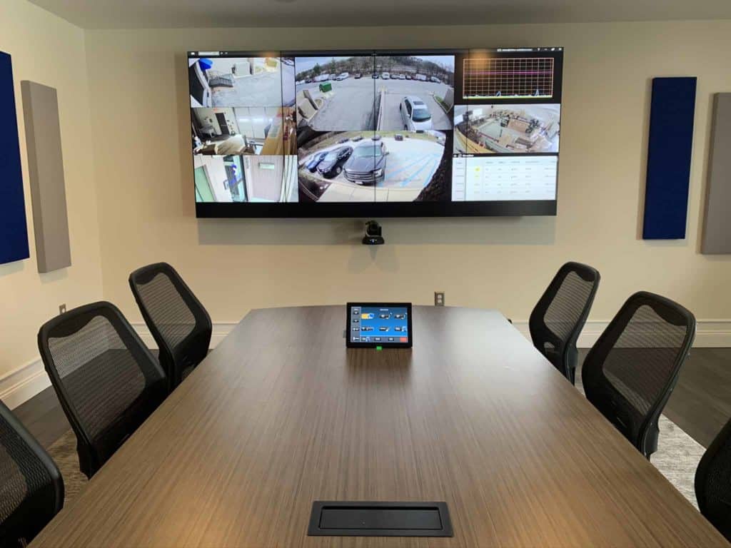 security surveillance on large television in a conference room