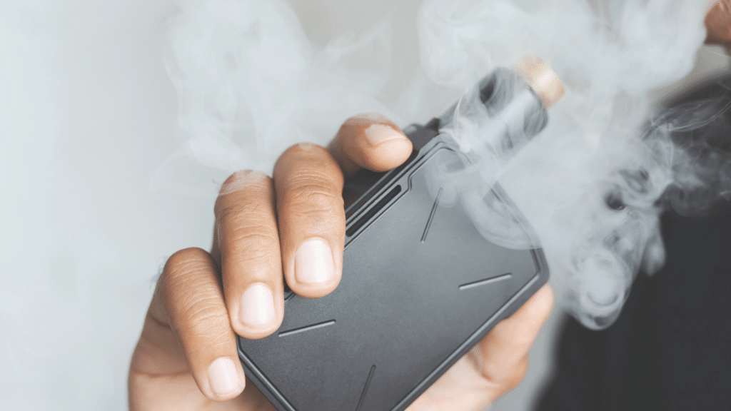 Person holding a vape