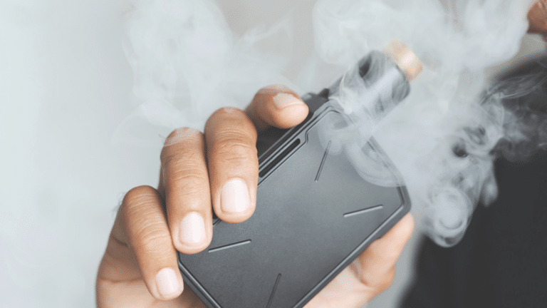 Person holding a vape