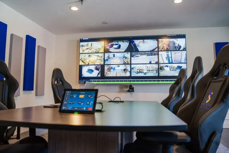 Security camera feeds showing on a conference room AV display