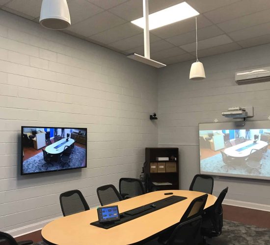 tv on wall, projector, in conference room