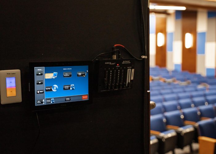 Closeup of an AV system control panel inside of an auditorium