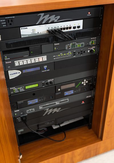 Closeup of an AV control system in a cabinet