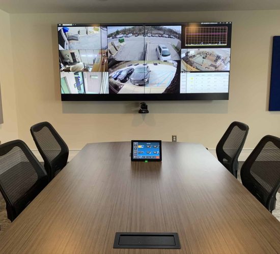 security surveillance on large television in a conference room
